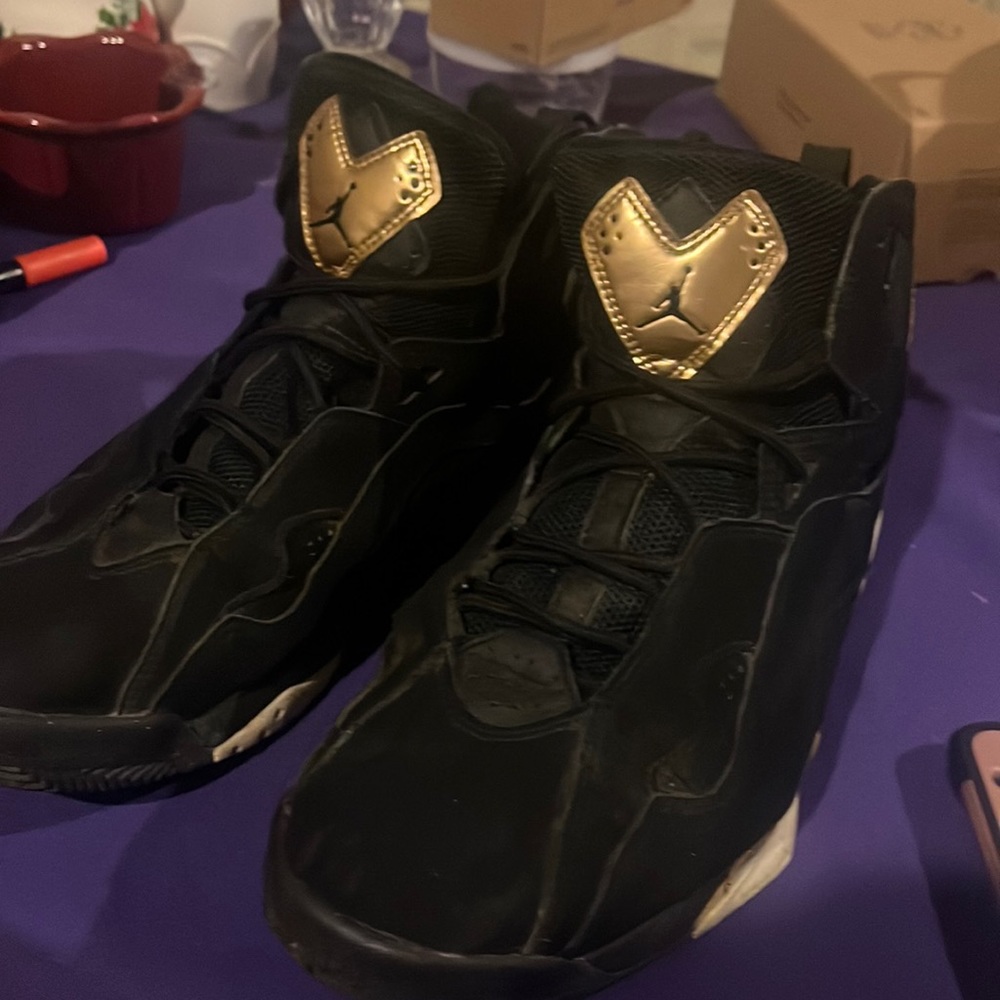 Black and gold Jordans